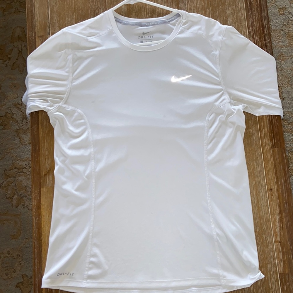 White Nike long-sleeve running shirt.